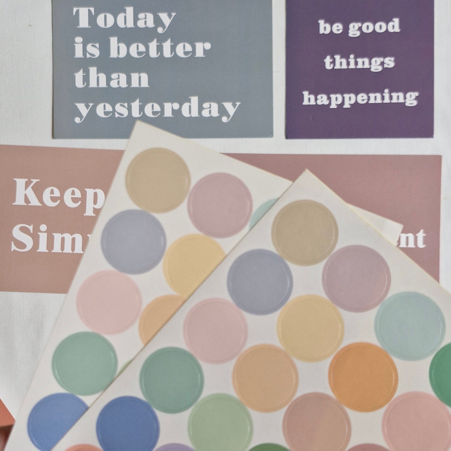 Motivational posters with text and a colorful polka dot design.