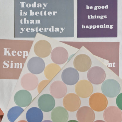 Motivational posters with text and a colorful polka dot design.