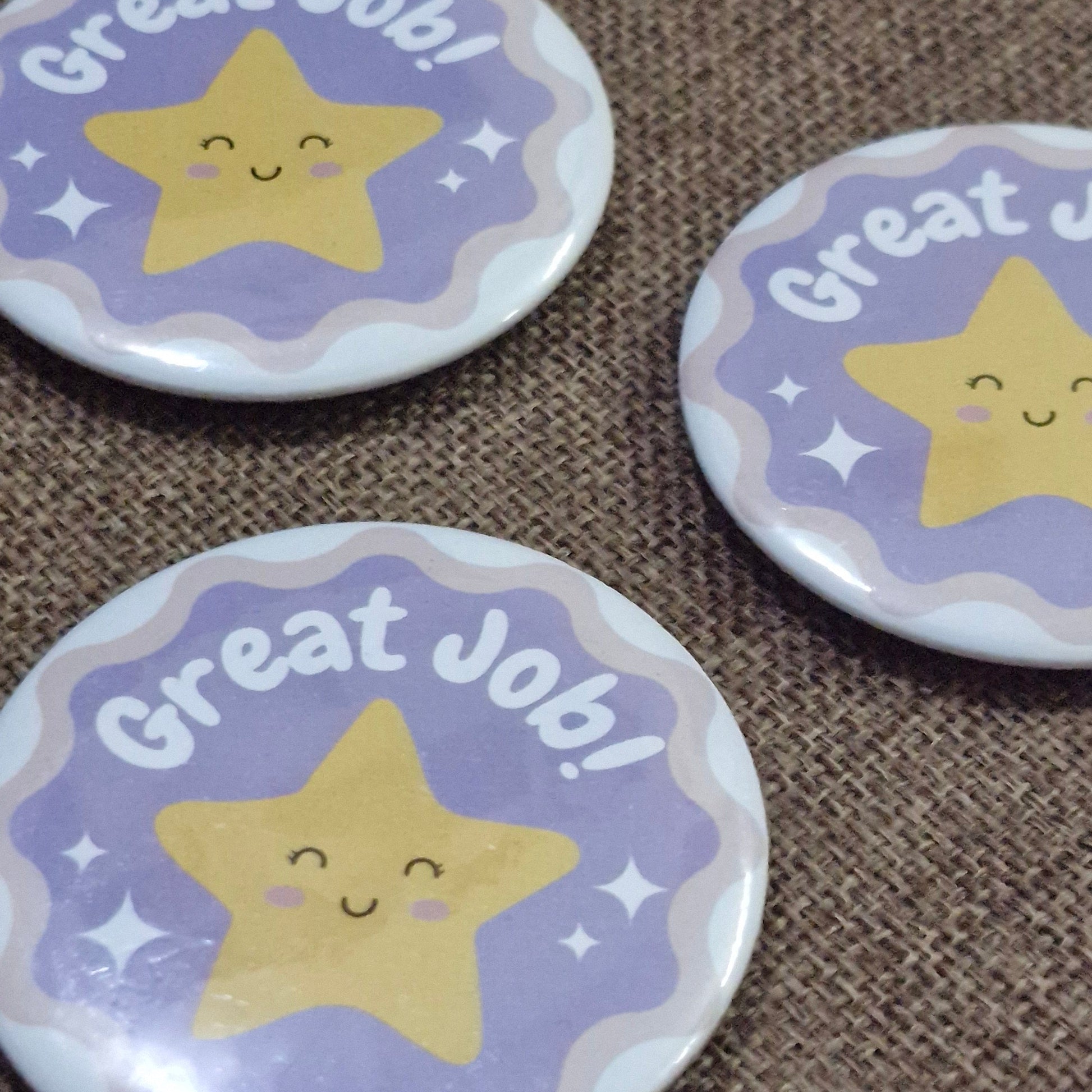 Three buttons with star designs and 'Great Job!' text on a brown textured background